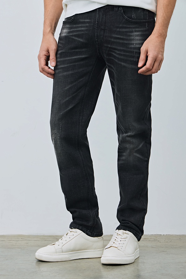 Черные джинсы с потертостями